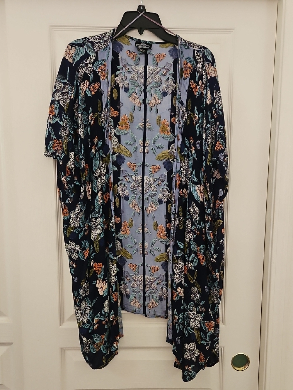 Angie | Floral flyaway Boho kimono with navy blue base and multicolored florals.